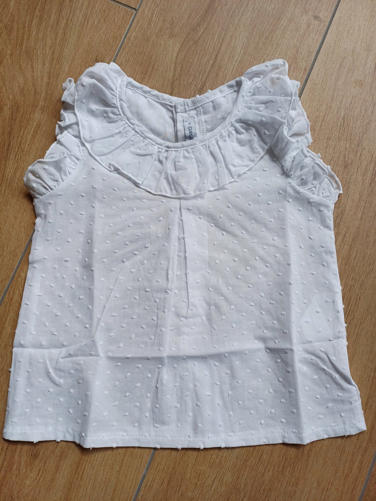Camicia in plumetis giro maniche